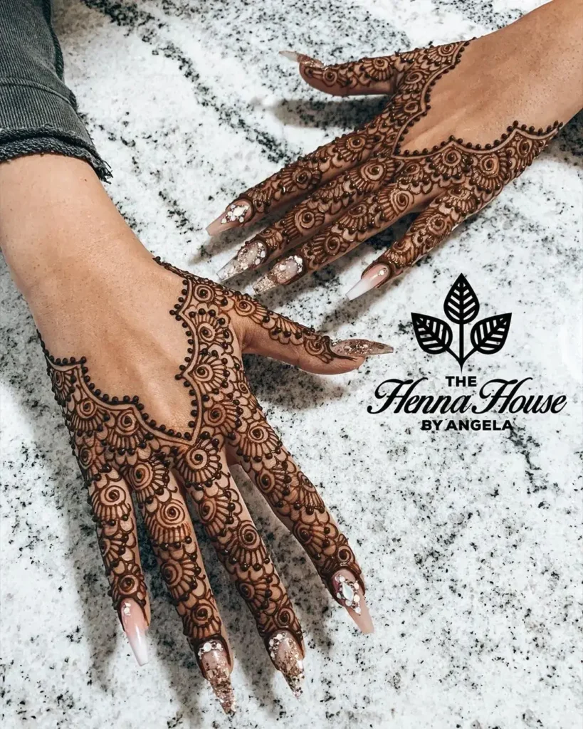 60+ Modern Mehndi Designs for Karwa Chauth (2026) 24 Karwa Chauth Back-hand Mehndi with Swirls