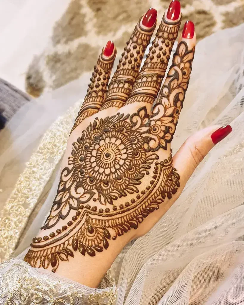 60+ Modern Mehndi Designs for Karwa Chauth (2026) 49 Karwa Chauth Special Floral Mandala Mehndi Design