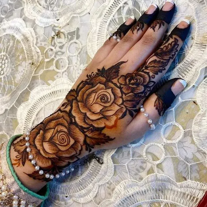 60+ Stylish Back Hand Mehndi Designs You Must Try in 2026! 22 jewellery and rose combo back hand mehndi designs