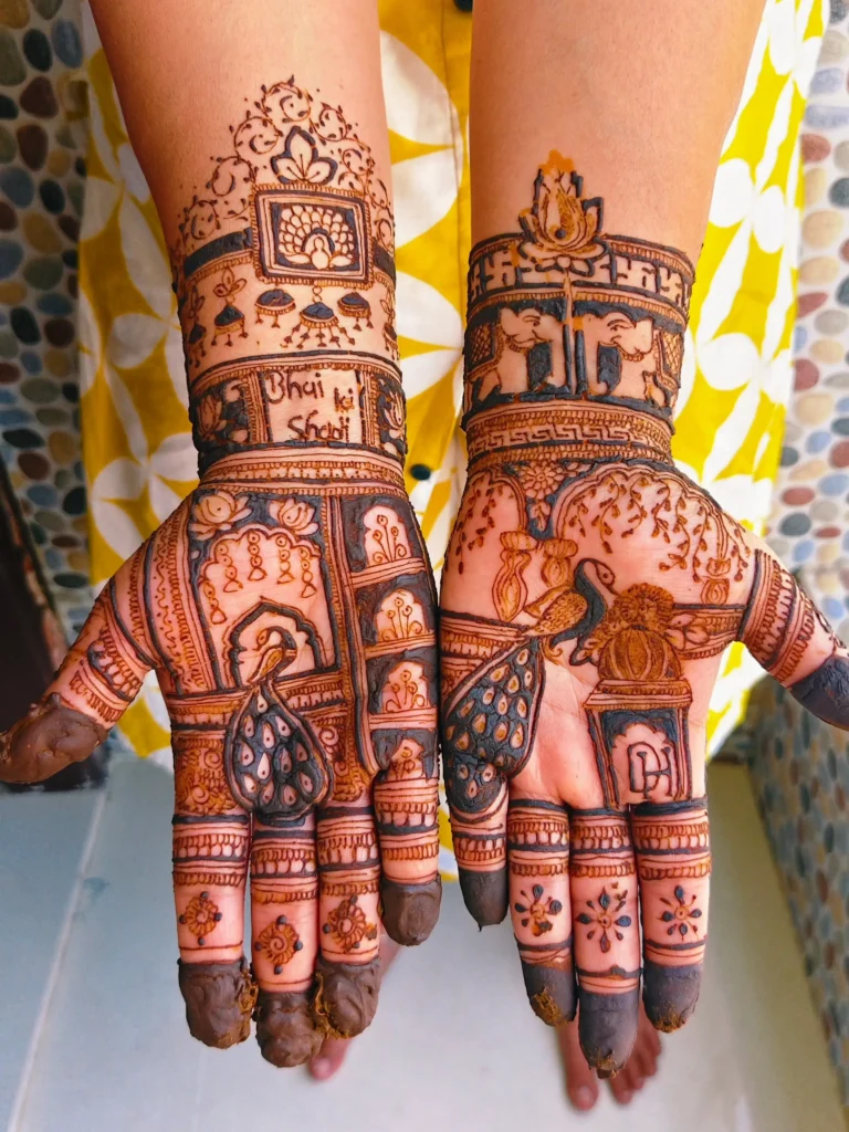 lotus with peacock and temple bell motifs mehndi designs
