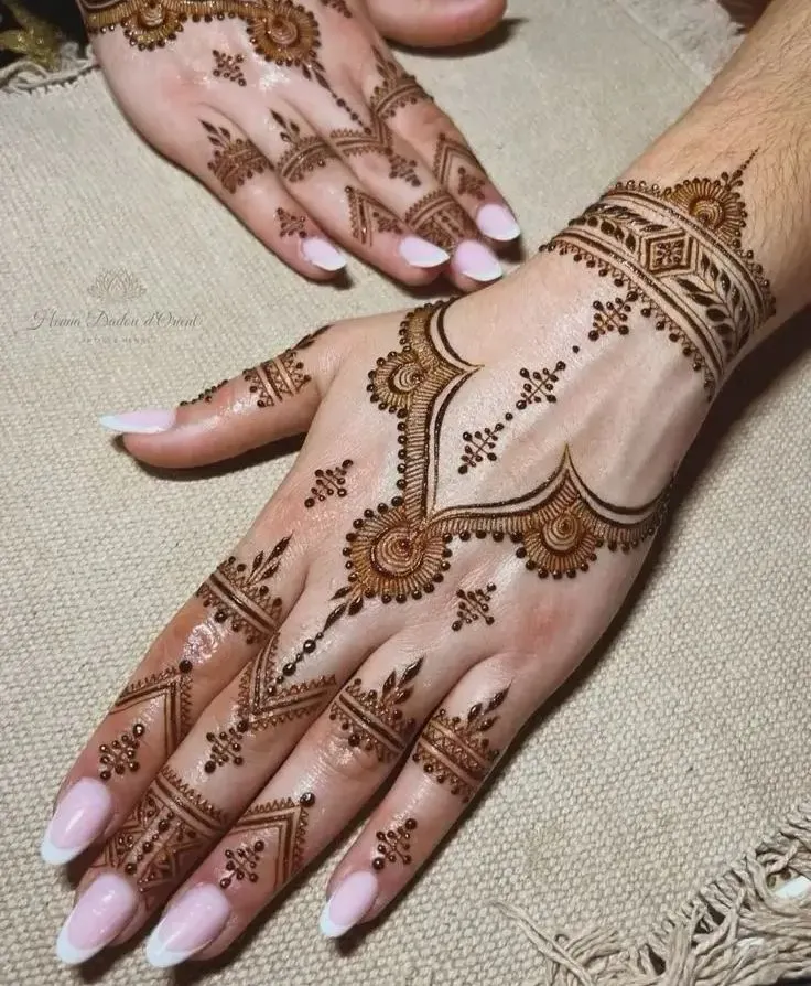 minimal back hand with negative space arabic mehndi designs