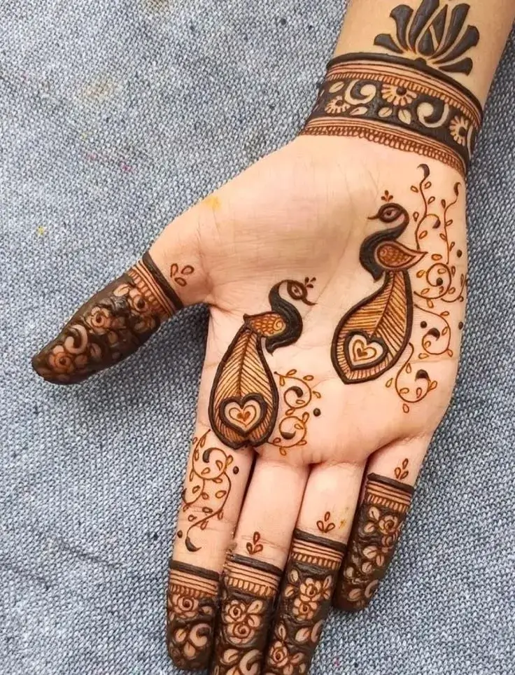 Finger Mehndi Design: 40+ Ideas for When the Event Is Tomorrow 46 peacock crest at the fingertip mehndi design