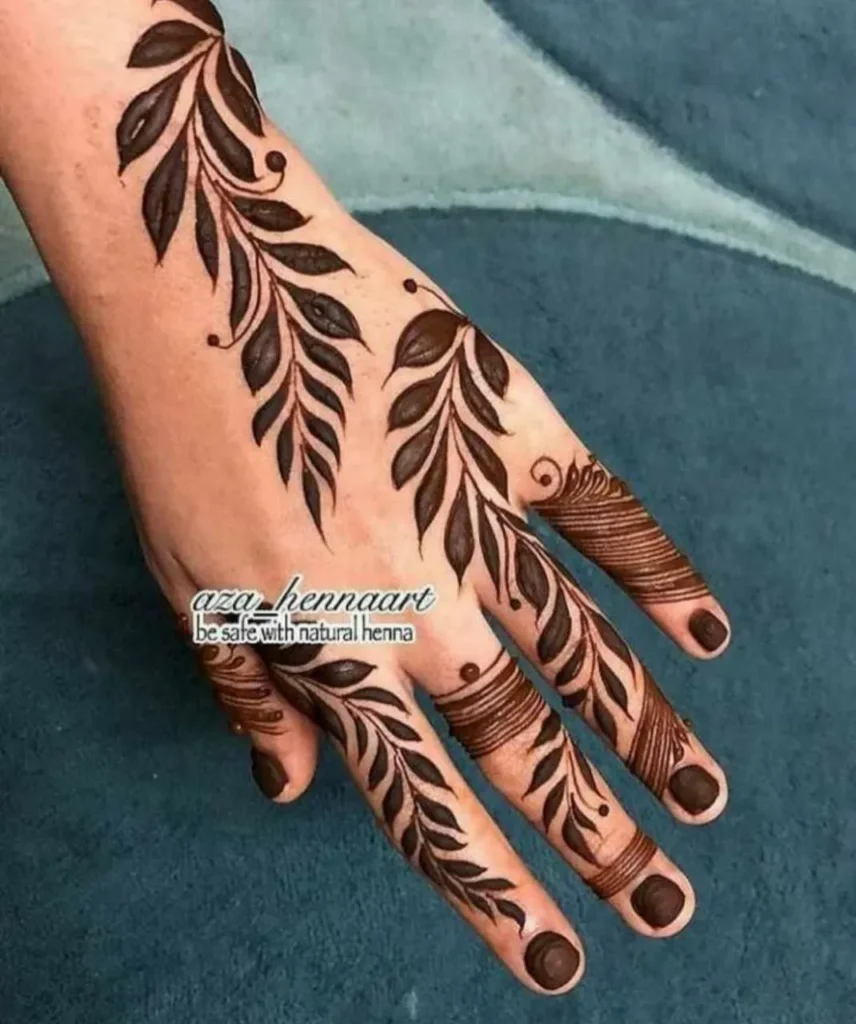 Finger Mehndi Design: 40+ Ideas for When the Event Is Tomorrow 31 reverse-filled leaf finger mehndi design