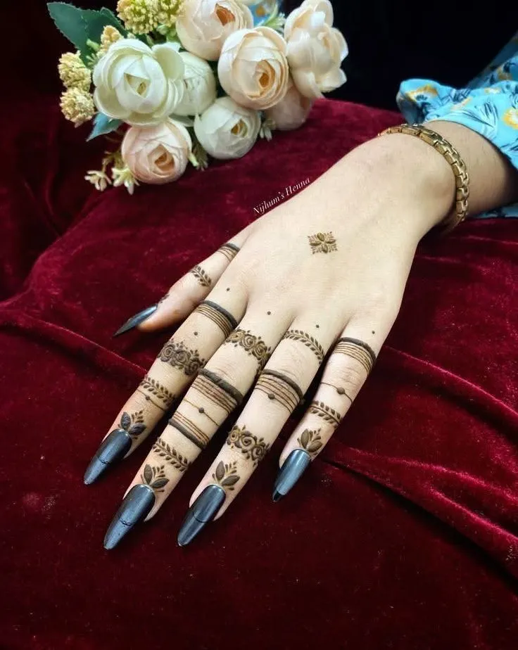Finger Mehndi Design: 40+ Ideas for When the Event Is Tomorrow 13 stacked ring bands below the knuckle finger mehndi design